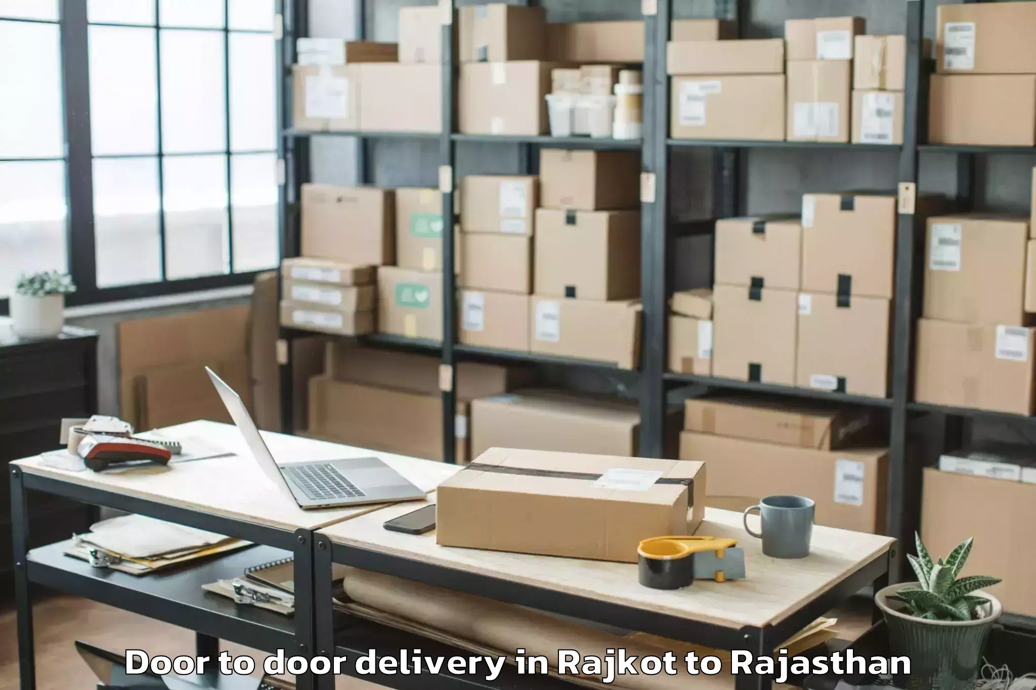 Reliable Rajkot to Opjs University Churu Door To Door Delivery